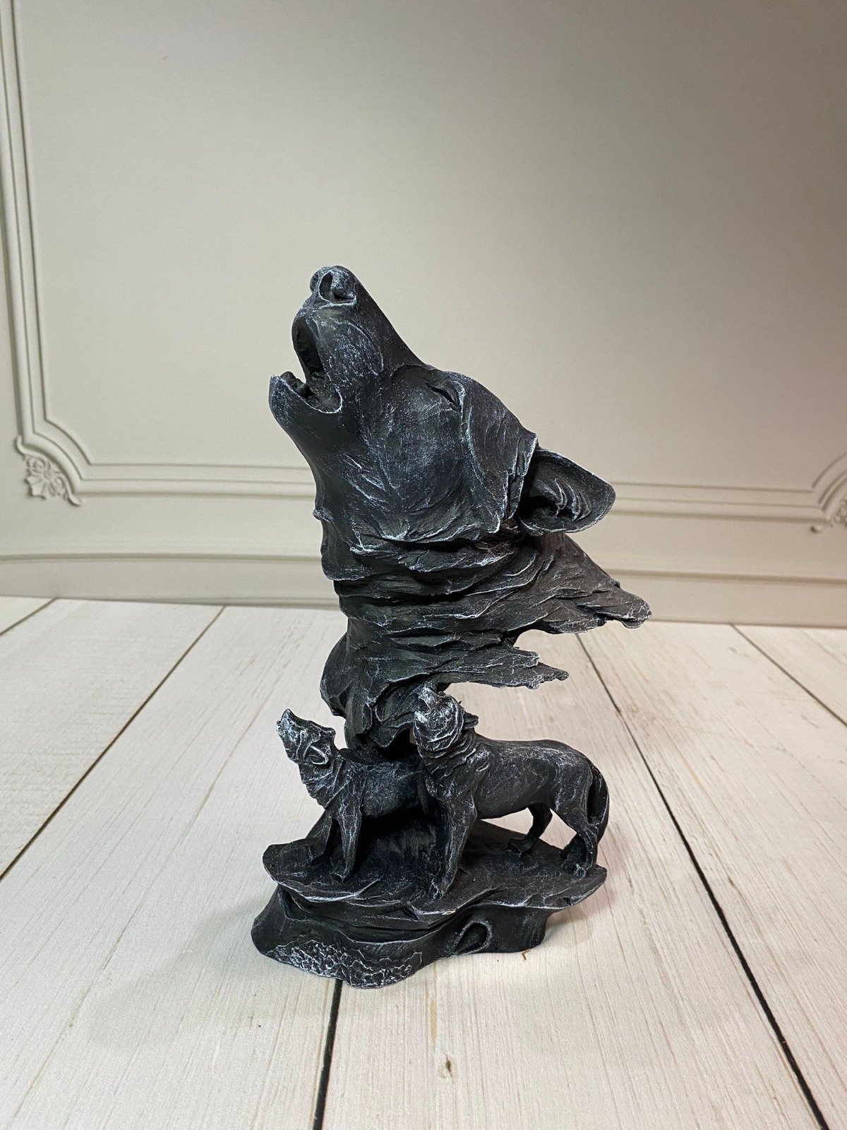 A big fox figurine accompanied by 2 small foxes