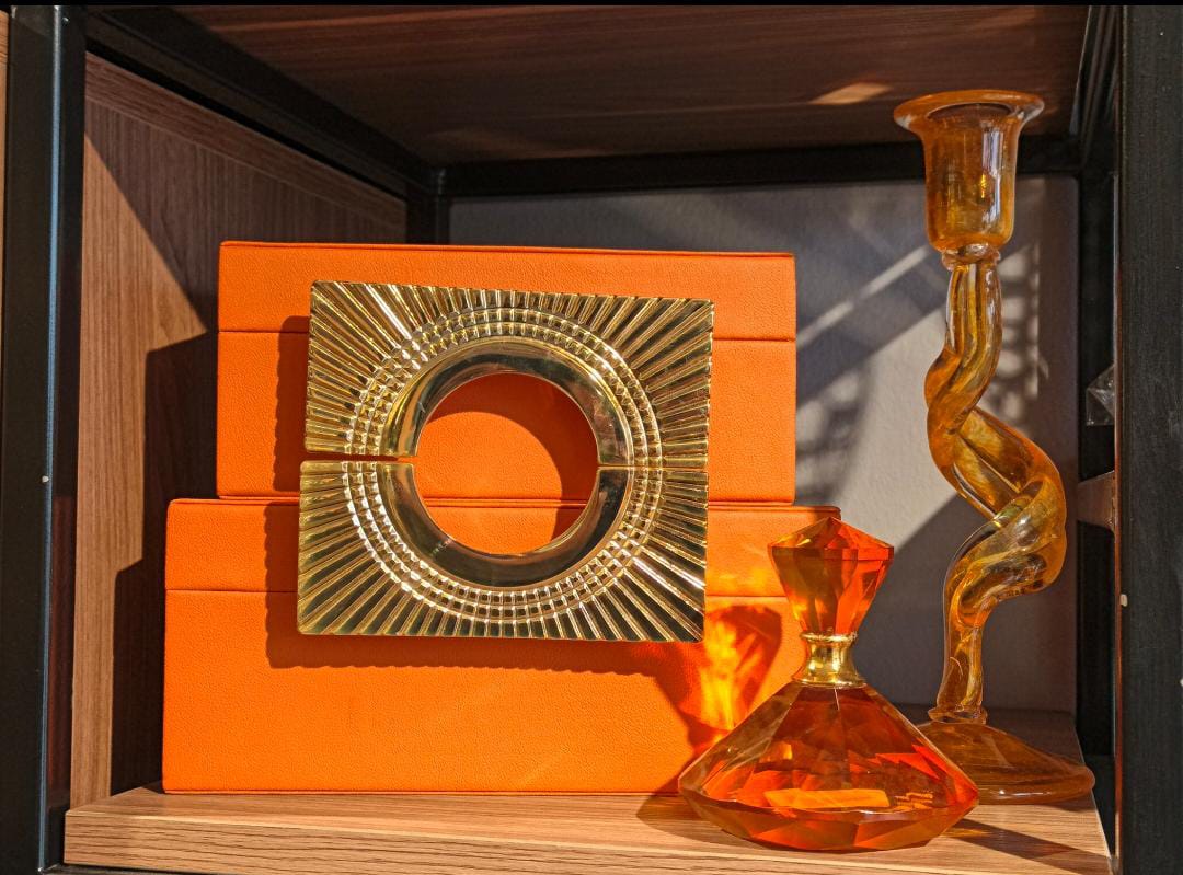 Orange decorative  box with a luxurious gold handle