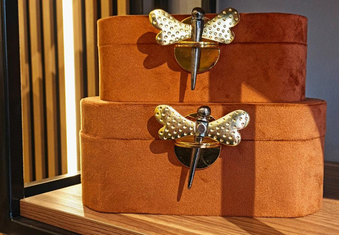 Orange box with a golden butterfly