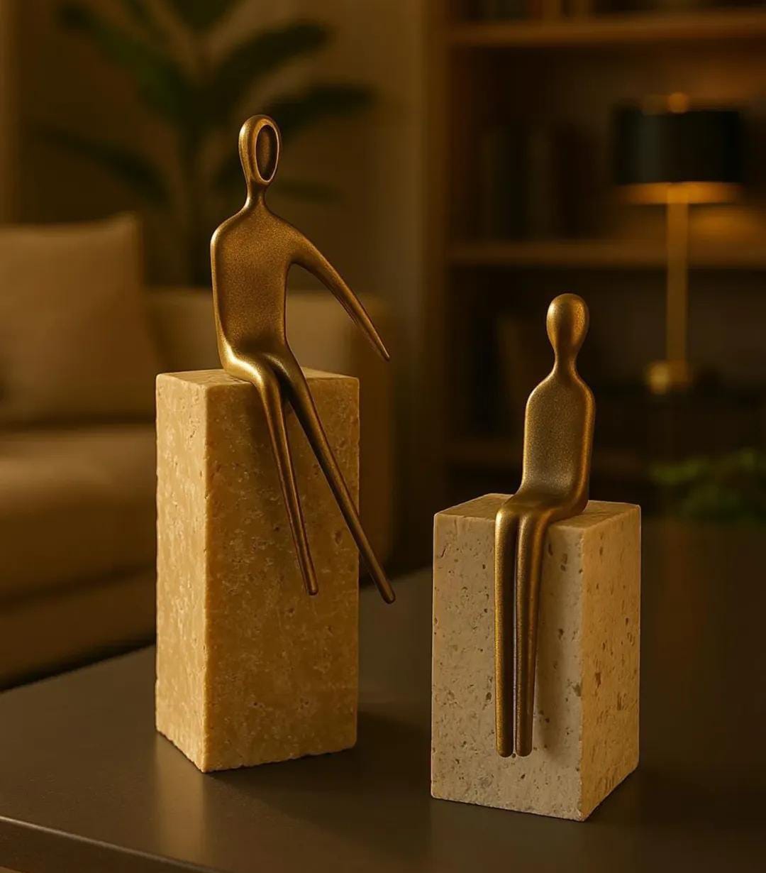 2 bronze person sit on a base travertine