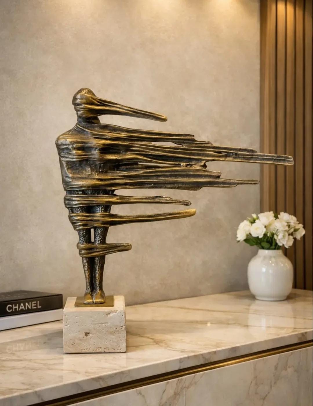 Bronze sculpture on a base travertine