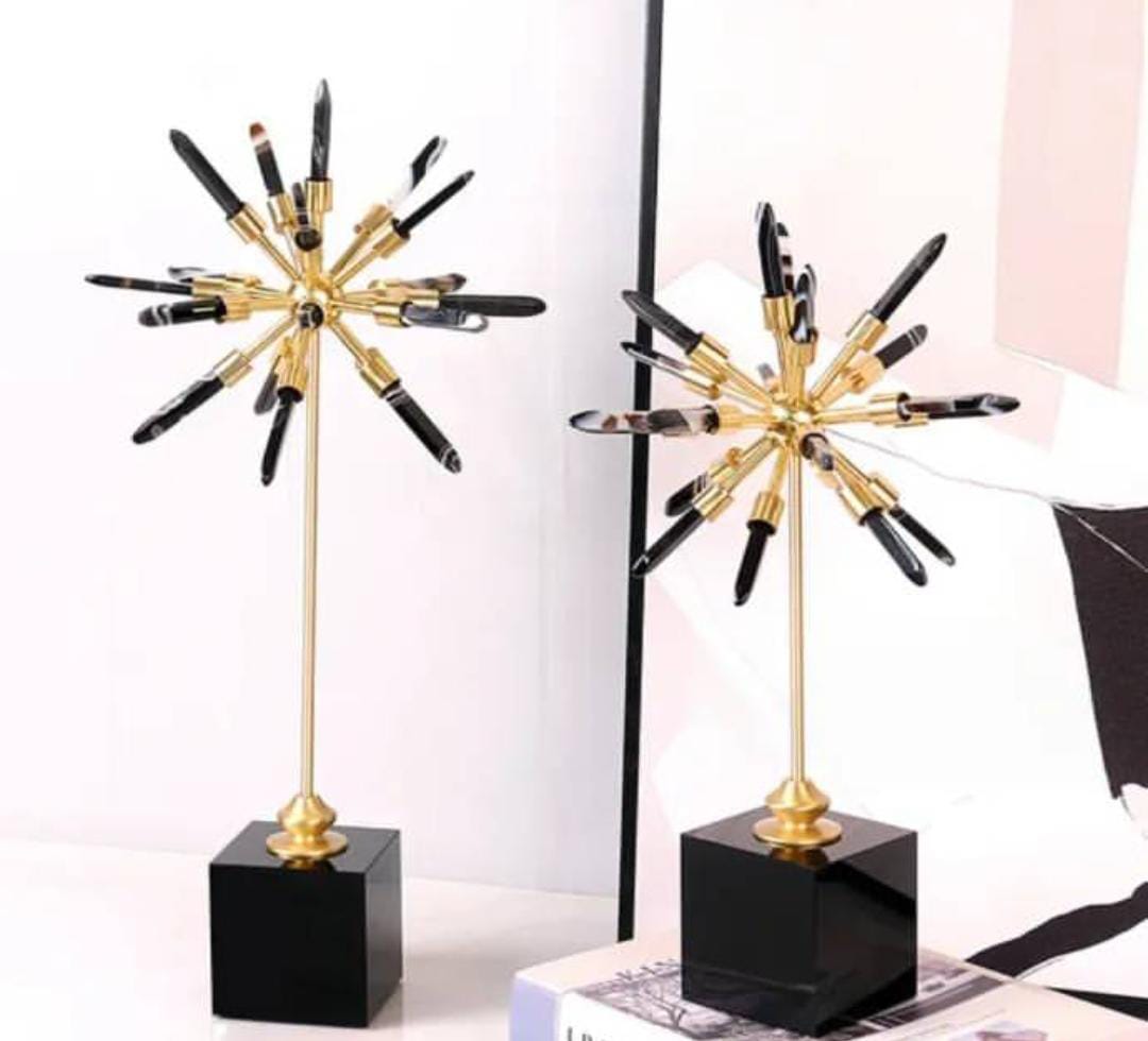 Set of black and gold decor on a marble base