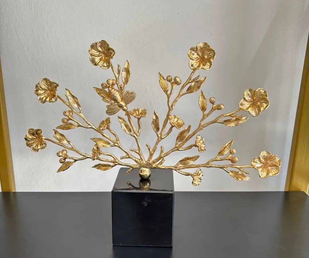 Gold tree and flowers on black marble