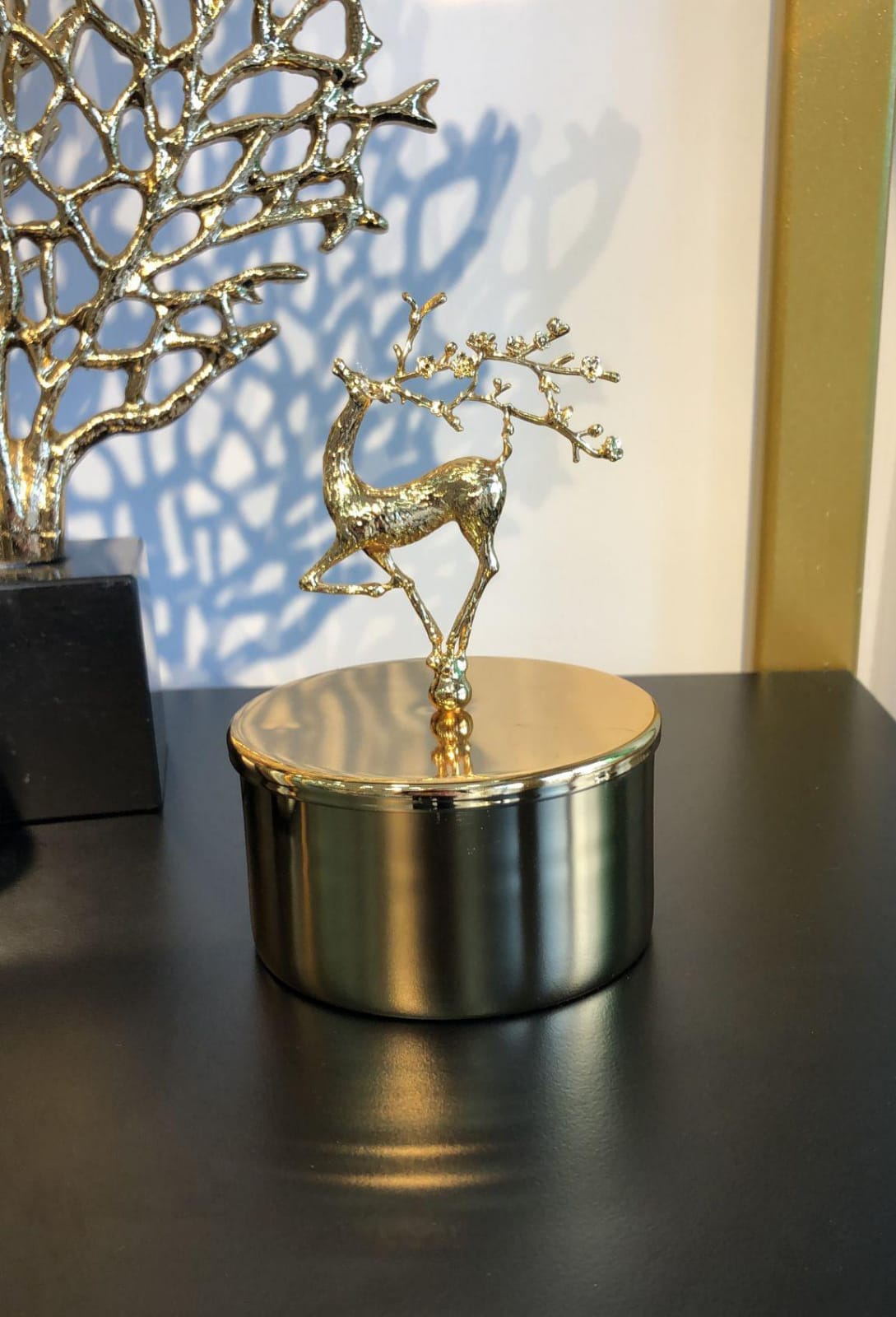 Golden box with a deer decoration