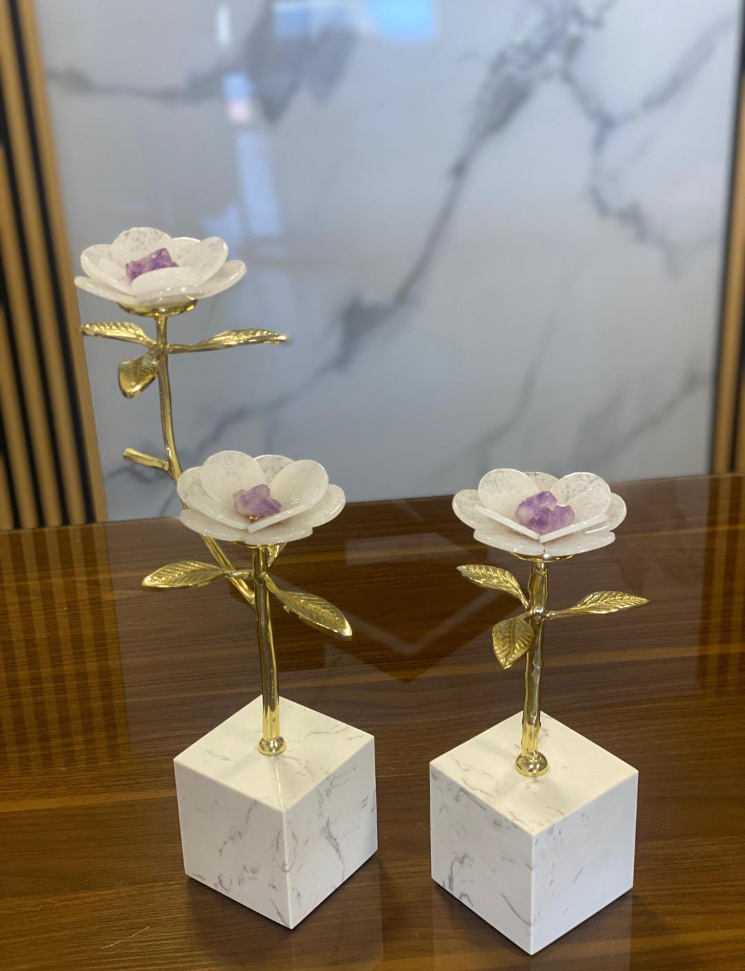 Decorative flower sculptures on a marble base