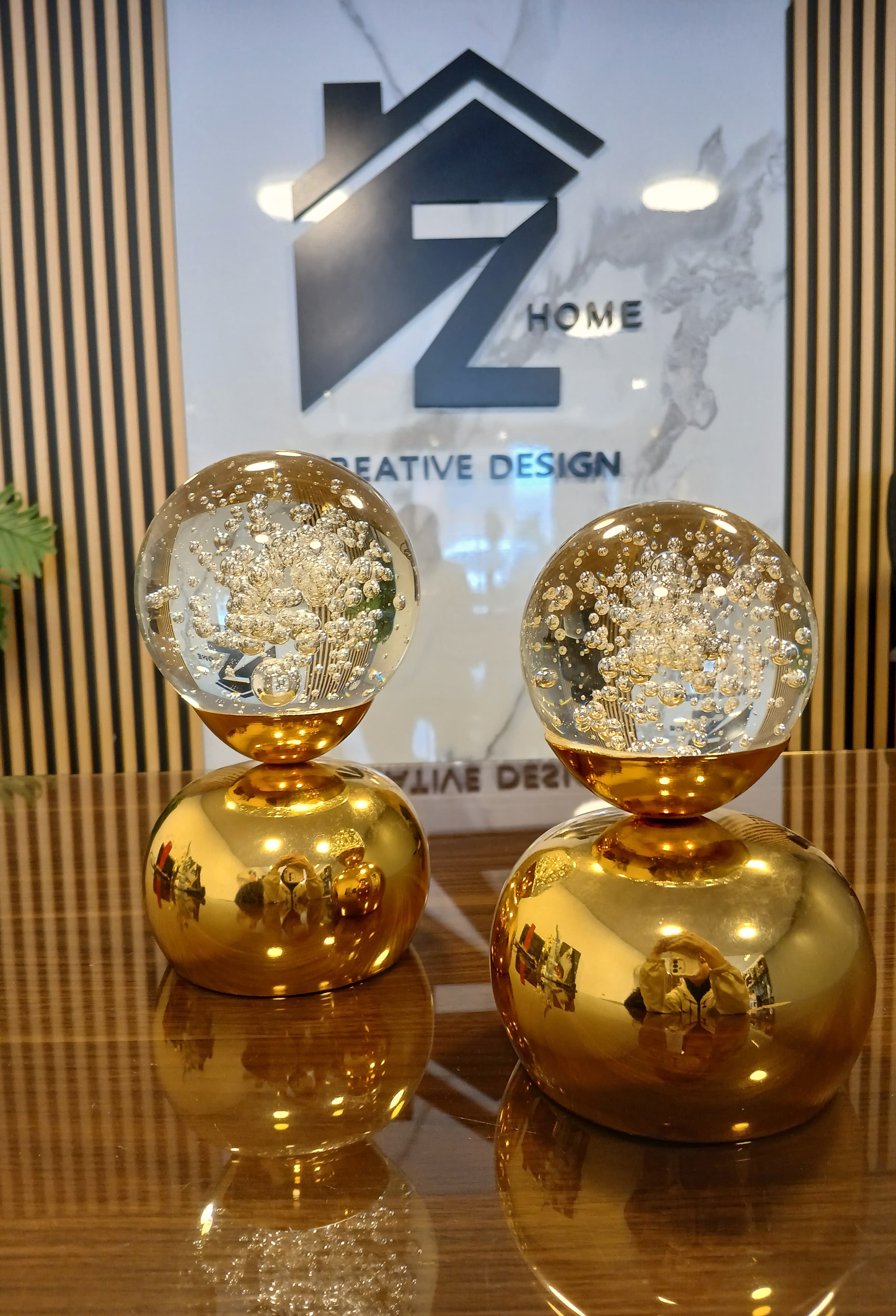 Set of 2 golden base with a ball
