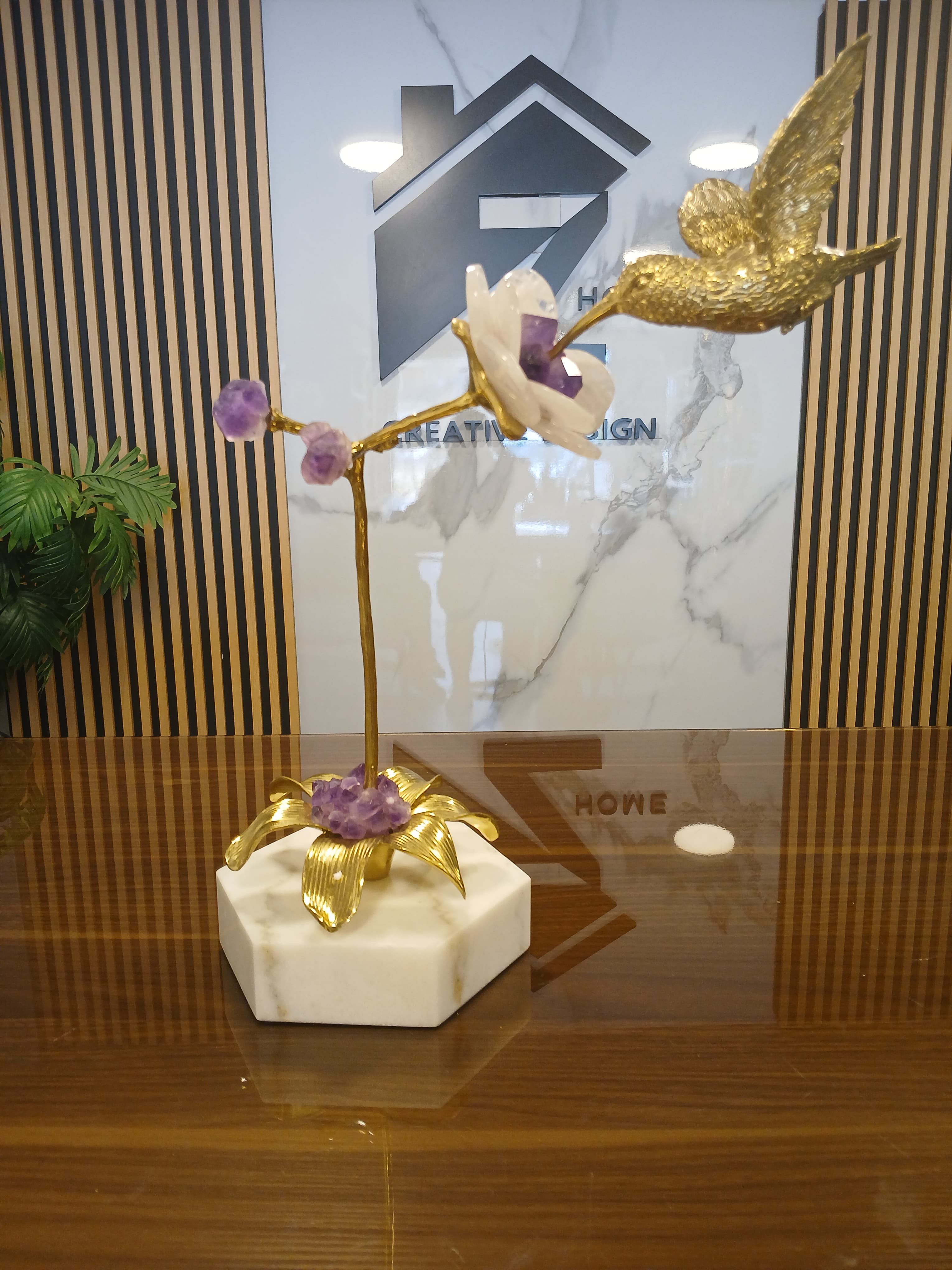 Bird eats a rose with marble